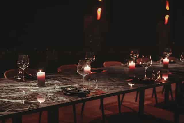 Intimate marble dining table set for an executive dinner or VIP gala event.