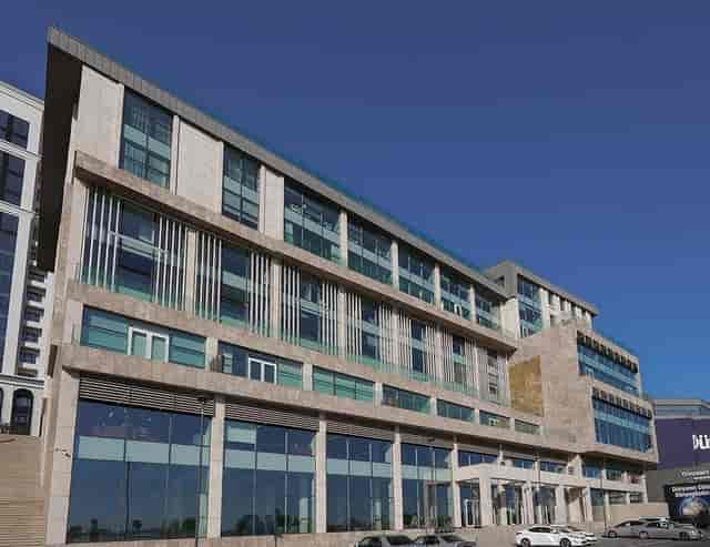 Modern Bayil Plaza business center with glass facade for corporate conferences and events.