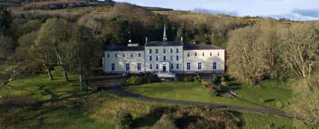 Orlagh House estate exterior, featuring classic architecture for executive retreats and events.