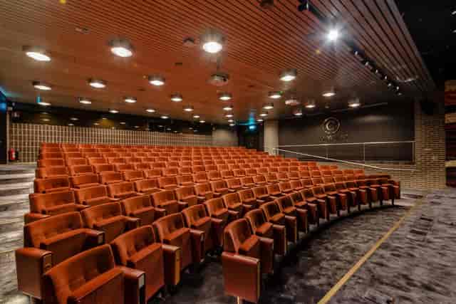 Modern Bond Auditorium with tiered seating for executive presentations and corporate events.