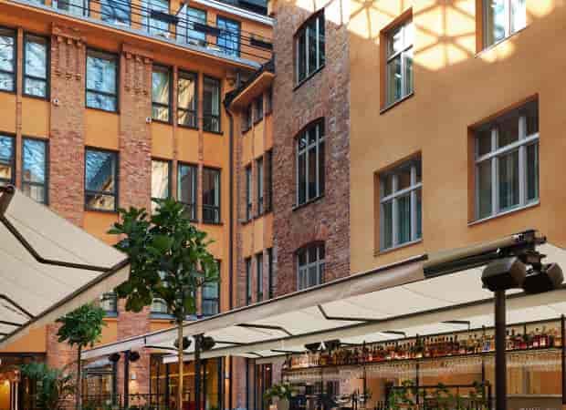 Dagges courtyard: retractable glass roof at Hotel Villa Dagmar, upscale cocktail reception venue.