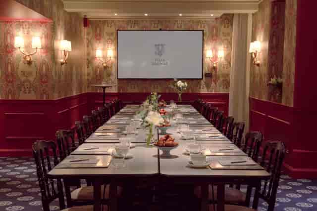Boardroom setup in Hotel Villa Dagmar with long table, ideal for corporate meetings and events.