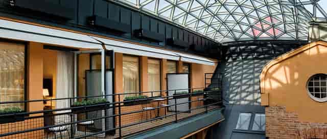 Glass-roofed Garden mezzanine at Hotel Villa Dagmar, ideal for intimate networking and breakout events.