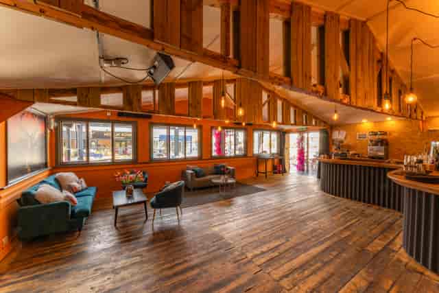 "Bird of Paradise Bar event space with warm wooden accents for networking and gatherings"