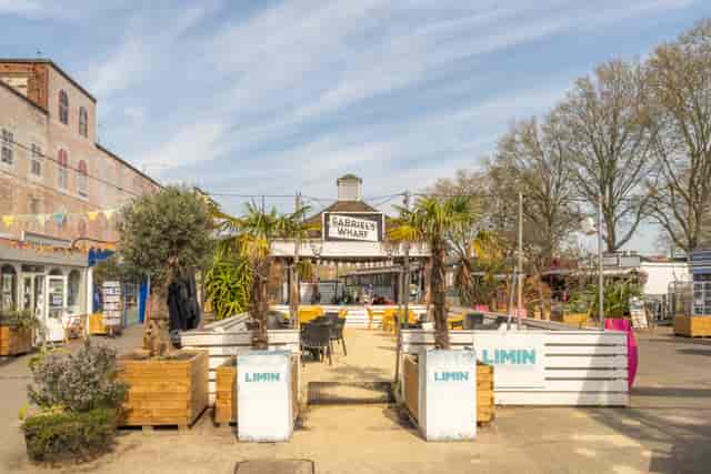 Vibrant outdoor venue at Limin Southbank for events and workshops with palm trees.