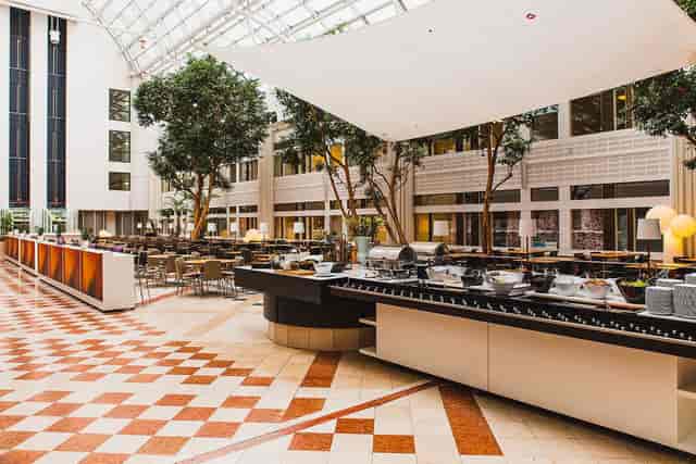 World Trade Center Stockholm atrium with buffet setup for large corporate events and conferences.