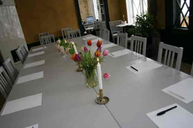 Rustic boardroom setup at Stora Henriksvik for workshops and corporate offsites.