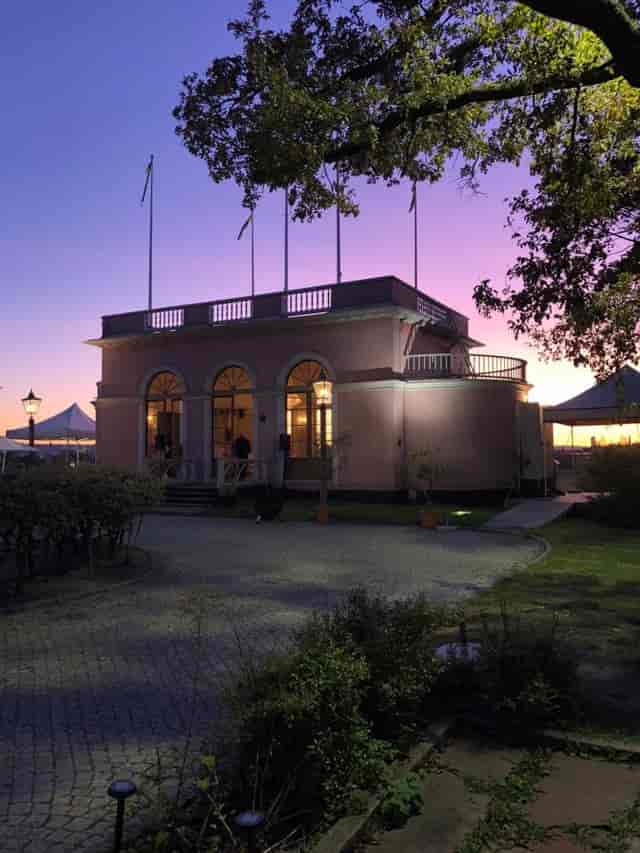 Kungliga Borgen courtyard venue with marquee tent for atmospheric evening wedding reception.