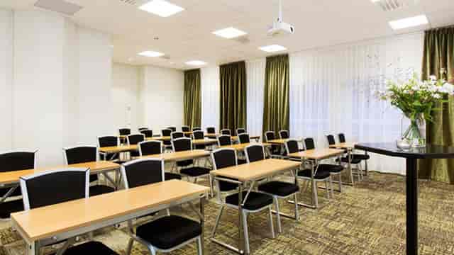 Vanadissalen meeting room, classroom setup for professional training workshops and events.