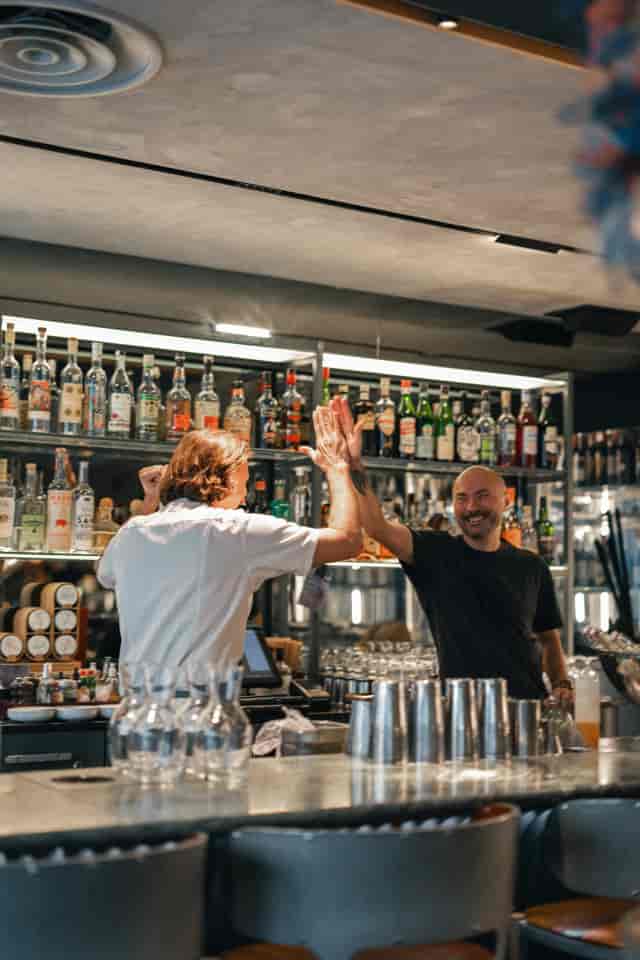 High-energy cocktail bar at Hillenberg event, featuring professional staff service.