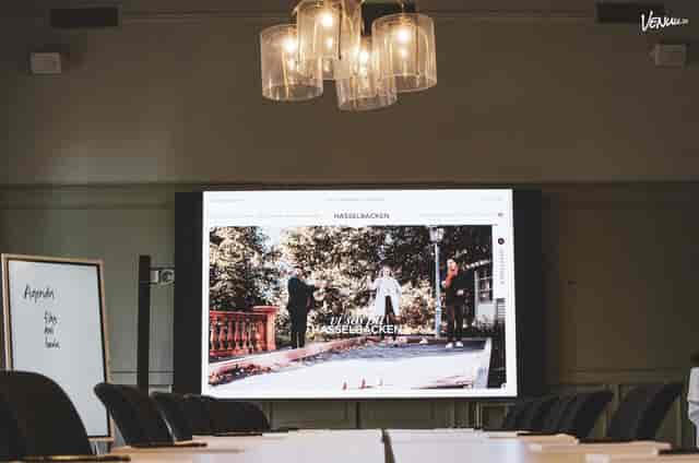 Hasselbacken boardroom with digital display for hybrid meetings and corporate events.