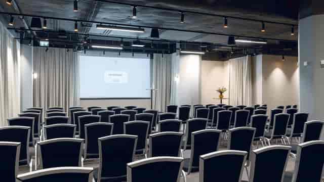 Modern theater-style meeting room at SIS Conference Centre for corporate training and seminars.