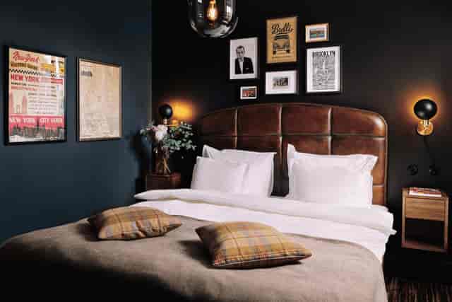 The Vault at NOFO Hotel: moody boutique guest room for VIP corporate retreats.