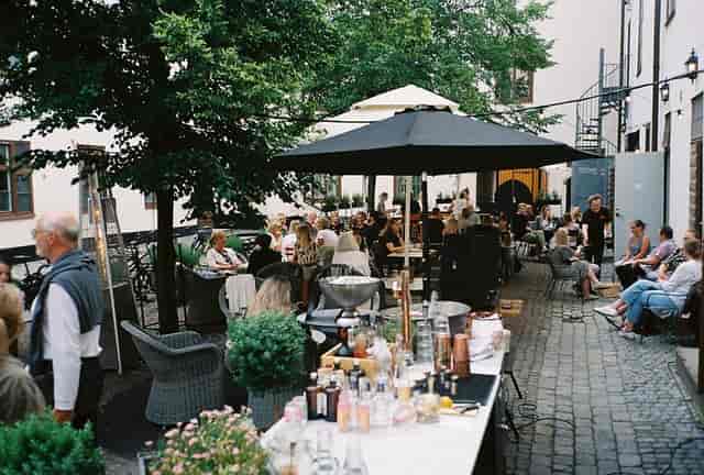 Intimate courtyard bar at NOFO Hotel, ideal for outdoor networking reception and corporate events.