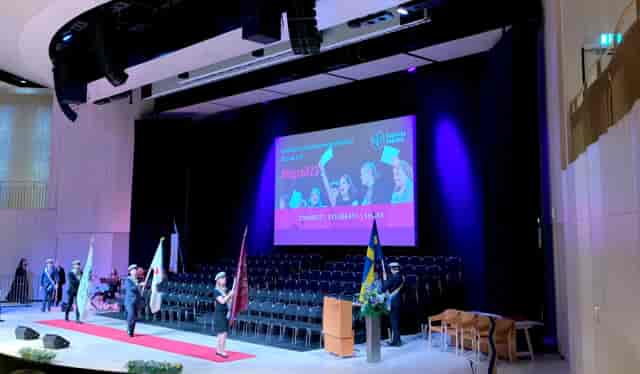 Erling Persson Hall stage with LED backdrop for formal academic or corporate ceremonial events.