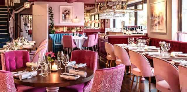 High-end 12th-floor restaurant with plush velvet seating for corporate dinners and networking events.