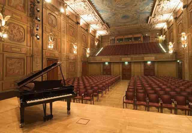 Grunewaldsalen auditorium: historic venue for corporate keynotes and intimate plenary sessions.