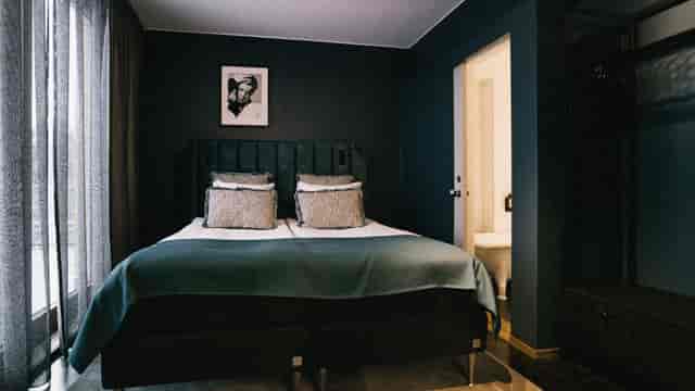 Upscale Backstage Hotel suite with mood lighting for executive travel and VIP event lodging.