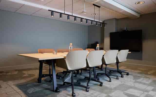Modern boardroom at Clarion Hotel Tapetfabriken with six-person setup for business meetings.