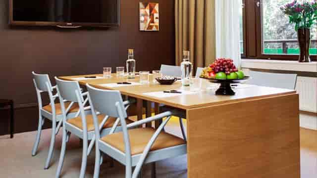 Boardroom at Hotel Stureplan: intimate meeting space with natural light for executive events.