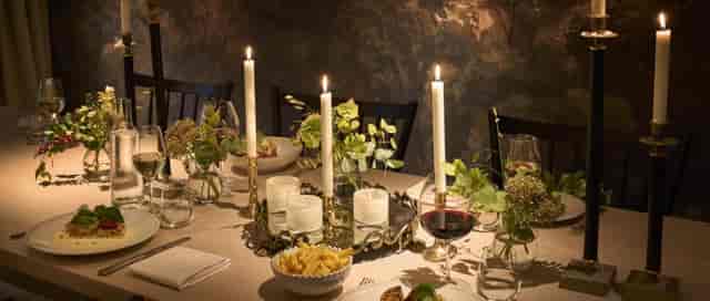 Elegant Villa Dahlia private dining with candlelight florals for luxury event and gala catering.