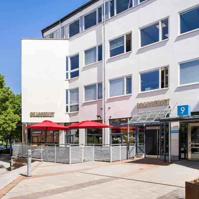 Private office exterior at Technopolis Kista with patio seating for business meetings and events.