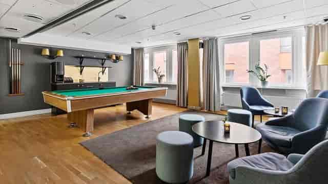 Best Western conference center breakout room with pool table for corporate team building events.