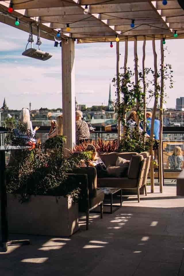 Rooftop bar with lounge seating and city views for networking events or VIP hospitality.