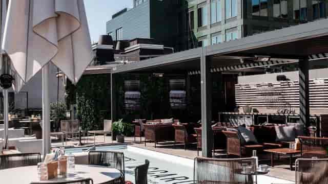 Rooftop terrace venue with lounge seating for cocktail receptions and networking events.