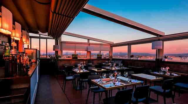 Bar in Cielo rooftop venue with retractable canopy for upscale cocktail receptions and dinners.