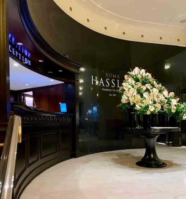 Luxury Palm Court hotel reception for corporate events and VIP registration.