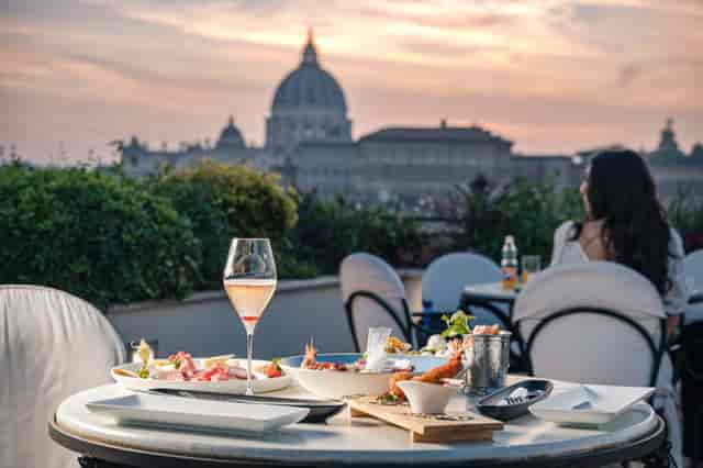 Rooftop terrace at Les Etoiles Rome for VIP corporate events and executive retreats at sunset.