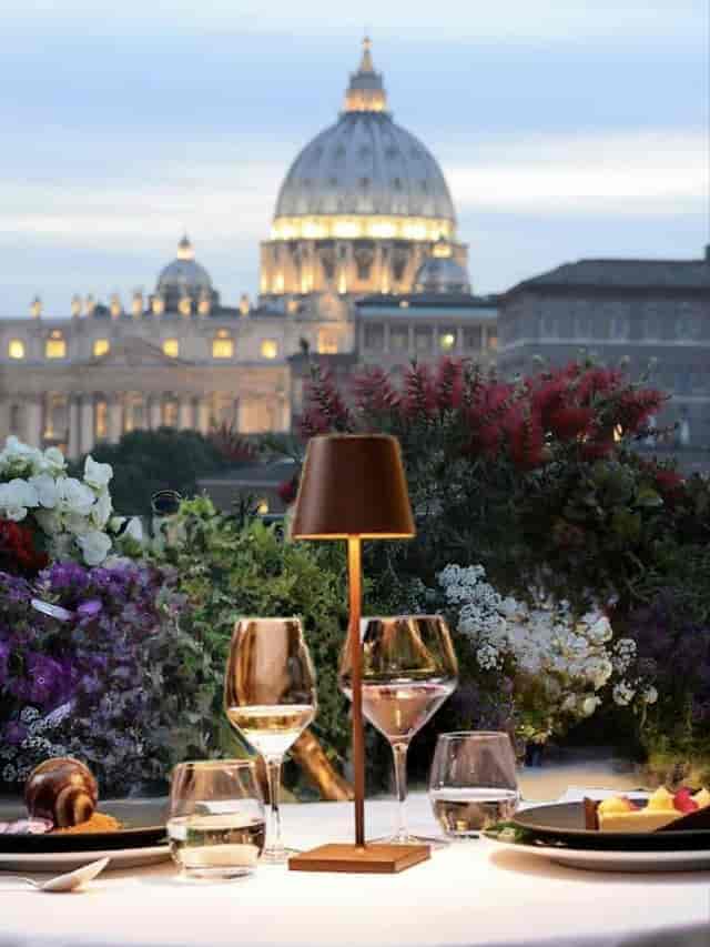 Rooftop bar at Terrazza Les Etoiles with St. Peter's Basilica view for exclusive cocktail receptions.