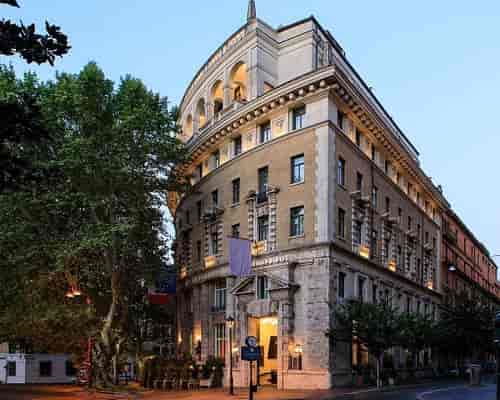 Historic Grand Hotel Palace Rome suite exterior for corporate events and luxury retreats.