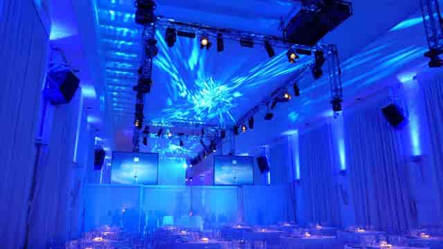 Spazio Novecento gala venue with dynamic truss lighting for corporate events and awards dinners.