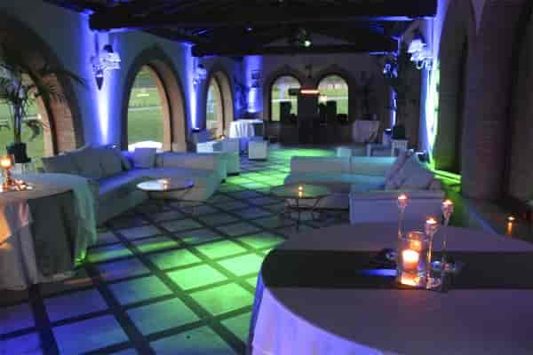 Luxury lounge at Villa Gianicolense with architectural uplighting for corporate reception events.