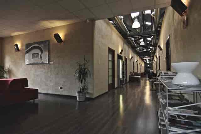 Industrial Sintelco Room at Officine Farneto, versatile networking space for conferences.