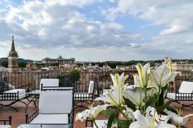 Rooftop terrace at Terrazza Borromini with lounge seating for corporate networking and events.