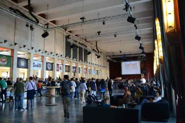 Salone delle Fontane industrial venue with lounge pockets for corporate events and conferences.