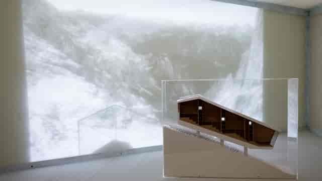 Immersive digital projection installation at MAXXI museum, architectural scale model display.