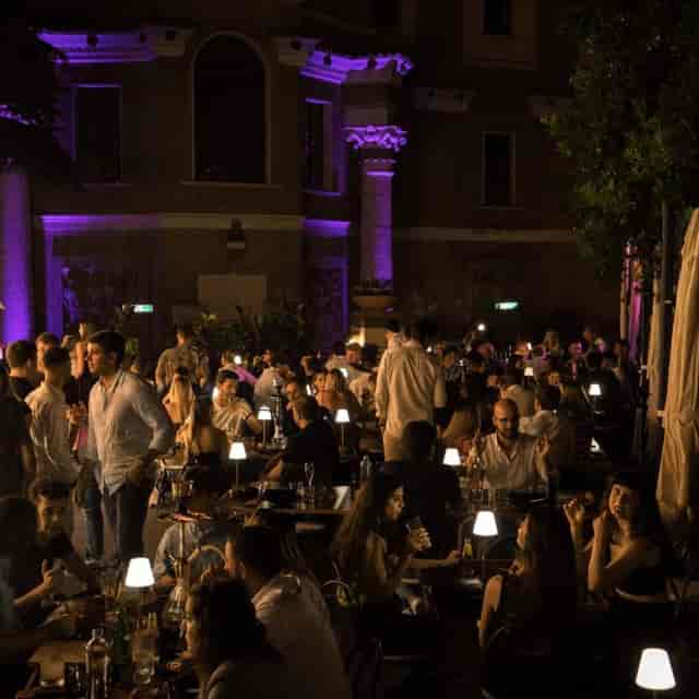 Gatsby Lounge at Villa Brasini: Purple ambient lighting for upscale outdoor networking events.