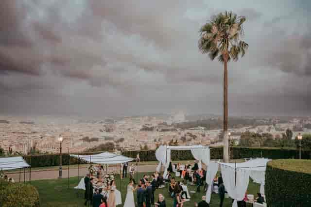 Outdoor event at Villa Miani with cityscape backdrop for luxury corporate gala or wedding.