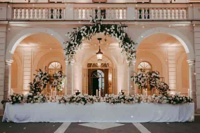 Luxury outdoor banquet setup at Villa Miani with floral decor for elegant wedding gala events.