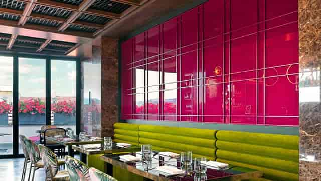 Modern hotel restaurant with plush seating for creative networking and team brainstorming events.