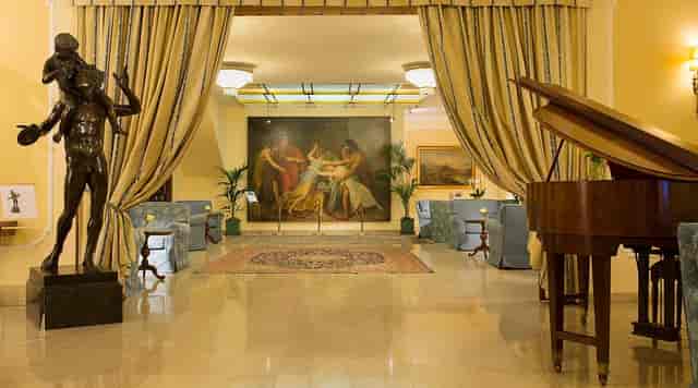 Hotel Napoleon banquet room with grand piano for upscale corporate receptions and networking events.