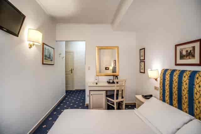 La Rochelle hotel room, functional budget space, ideal for business conference accommodation.