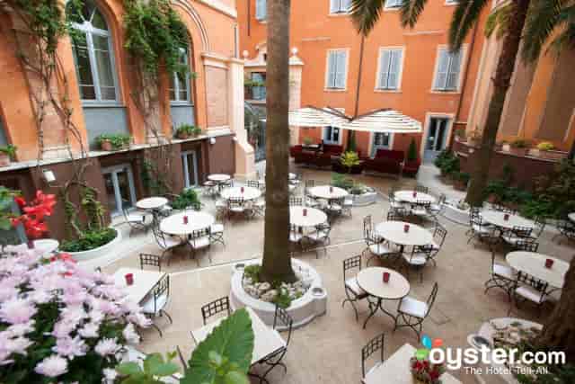 Rooftop terrace venue at Hotel Ponte Sisto with tiered seating for outdoor events and receptions.