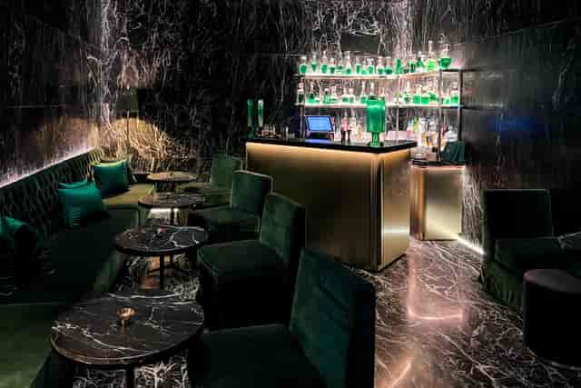 Jade Bar luxury VIP lounge with velvet seating for exclusive networking events.