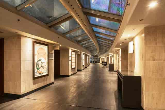 Romolo pre-function space with natural light for event registration and networking.