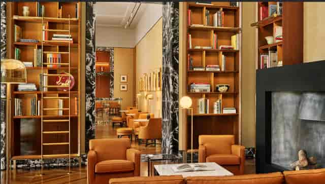 Bvlgari Hotel Roma library: Sophisticated club seating for high-end executive networking events.